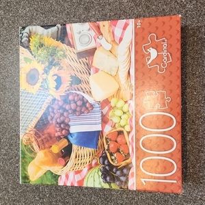 1000 piece Cardinal brand puzzle with picture of a picnic basket and food.